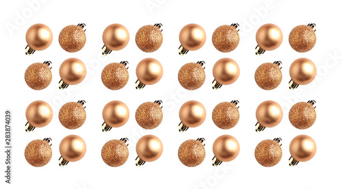 minimalistic pattern of christmas balls on white background. holiday concept, creative layout