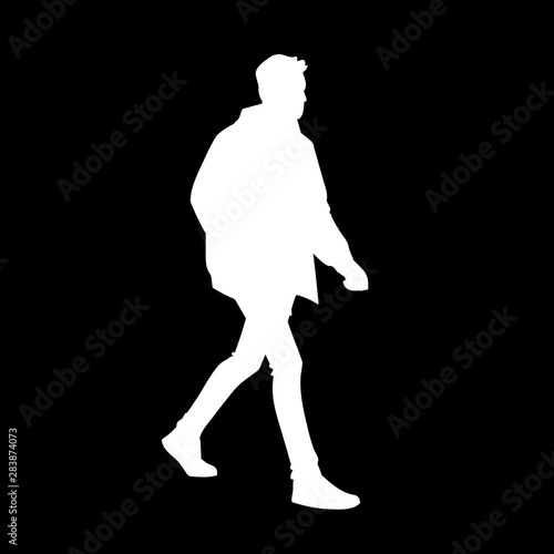 Young man in jacket, jeans and sneakers walking. White silhouette isolated on black background. Side view. Monochrome vector illustration of man taking a walk. Concept.
