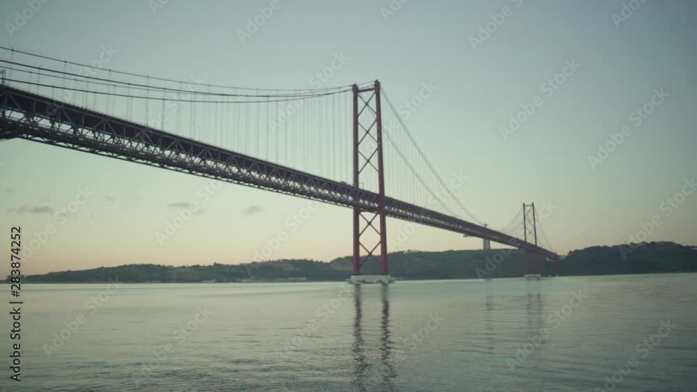 Lisbon Suspension bridge at dawn sunrise with river Lisbon Suspension bridge at dawn sunrise with river