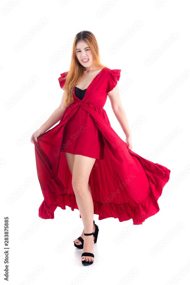 Full length of beautiful asian woman in red dress smiling and looking at camera over white background Full length of beautiful asian woman in red dress smiling and looking at camera over white background