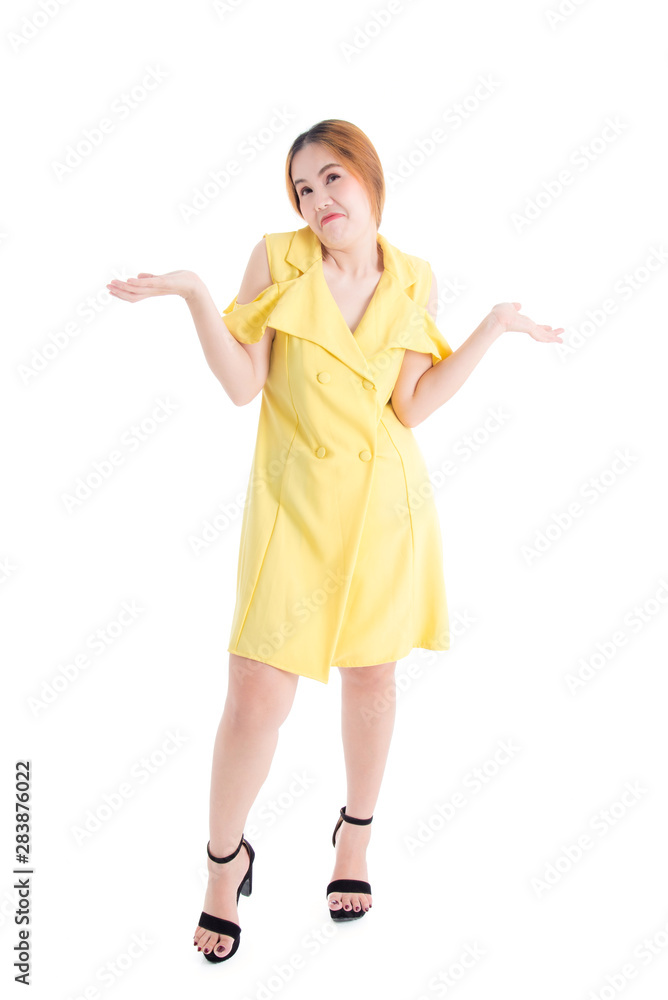 Full length of Asian girl in yellow dress Showing facial expressions to disregard certain things on the White Blackground Full length of Asian girl in yellow dress Showing facial expressions to disregard certain things on the White Blackground