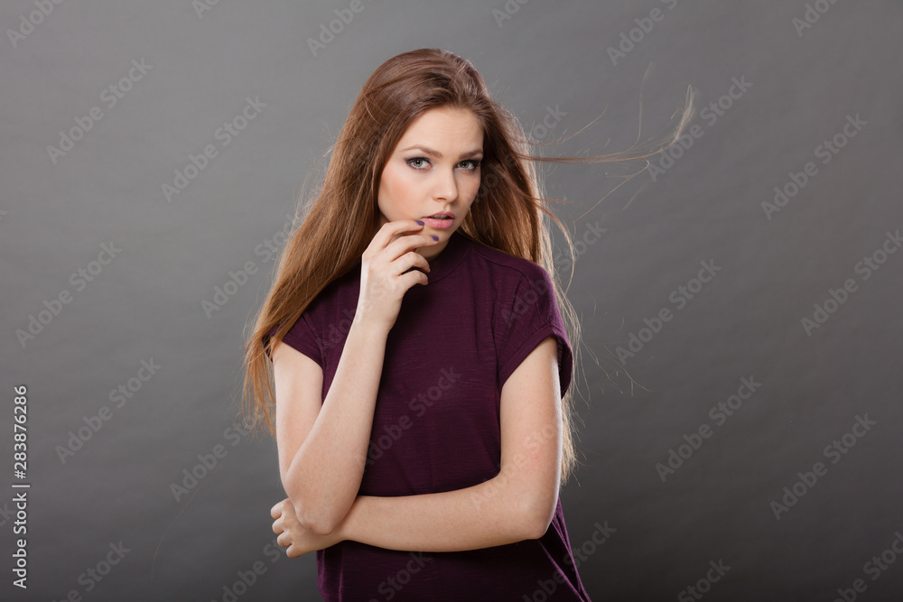 Attractive brunette woman with windblown hair Attractive brunette woman with windblown hair