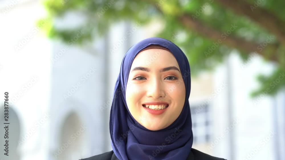 Muslim woman smiling. Muslim woman smiling.