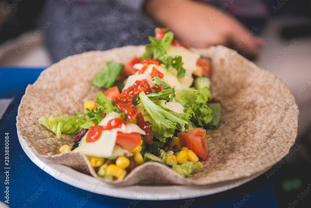 Taco tortilla healthy wrap with salad and sauce Taco tortilla healthy wrap with salad and sauce