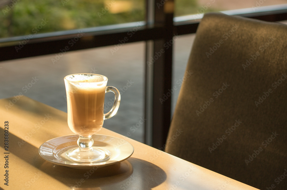 Morning coffee in a coffee shop with sunlight Morning coffee in a coffee shop with sunlight