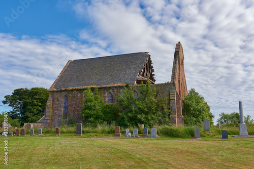 Side view of the ruin of Kinnell Church in a small Angus Hamlet near to Friockheim in Angus, Scotland. photo