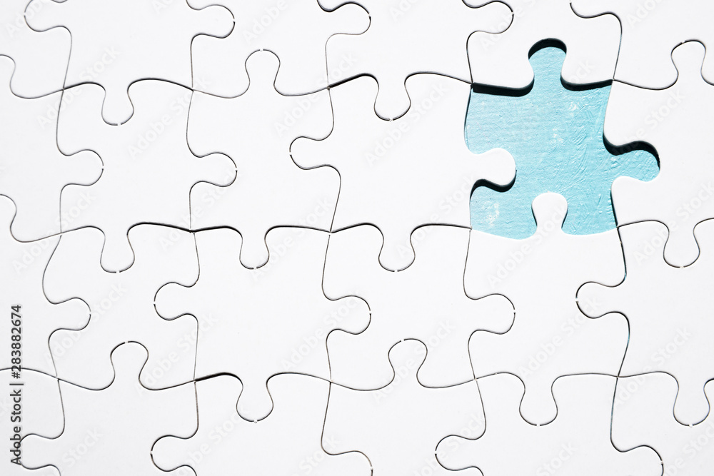 Piece missing from white jigsaw puzzle Piece missing from white jigsaw puzzle