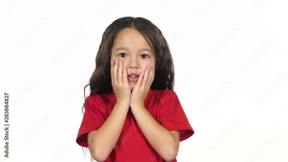 Girl posing surprisingly on white background. Slow motion Girl posing surprisingly on white background. Slow motion