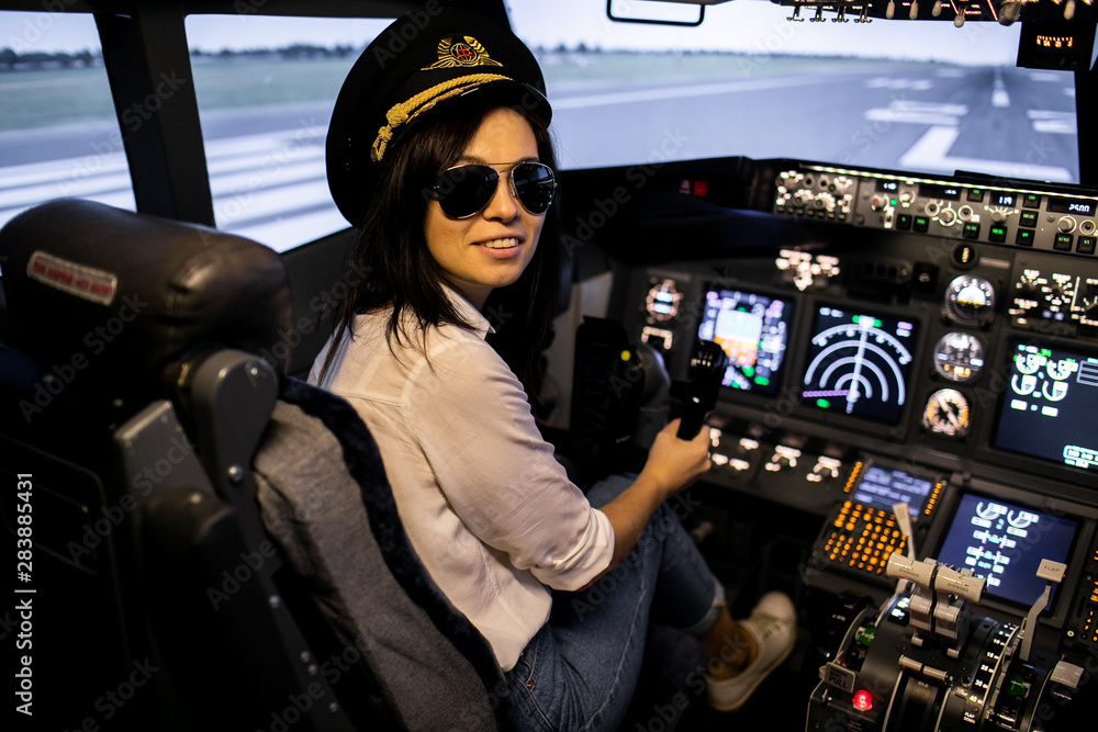 Female pilot the captain of the plane prepares for take-off in the plane cockpit. Female pilot the captain of the plane prepares for take-off in the plane cockpit.