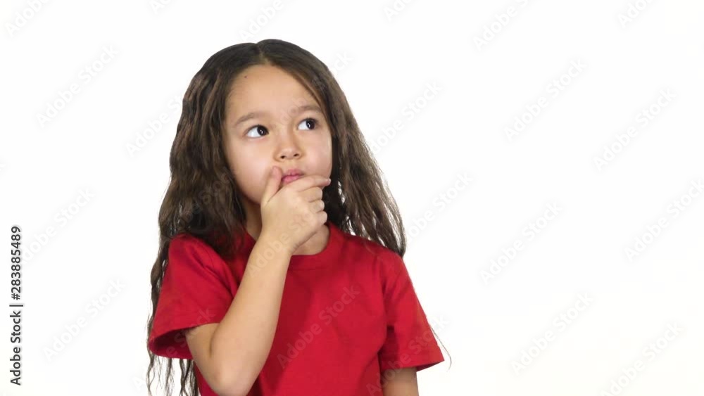Portrait of infant posing and thinking about something on white background. Slow motion