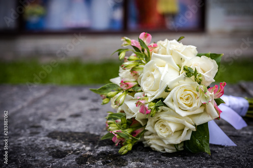 Beautiful bouquet of fresh flowers on a stone slab.