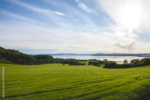 View of green fields and fjords