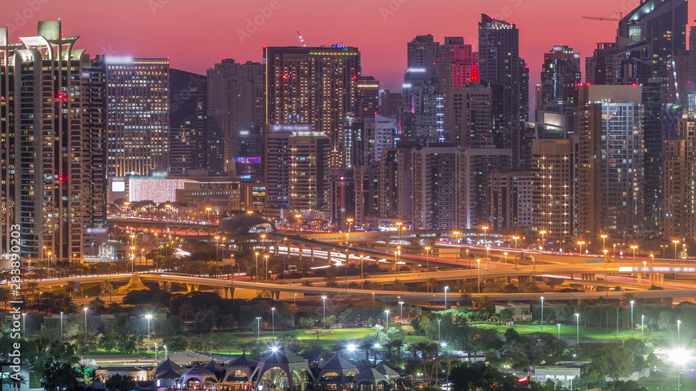 Dubai Marina skyscrapers and golf course day to night timelapse, Dubai, United Arab Emirates