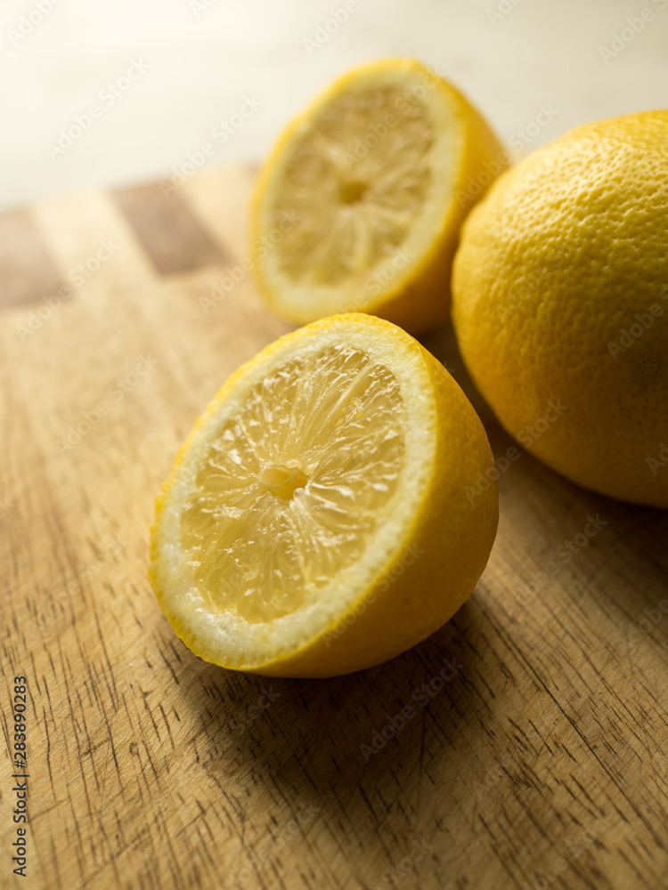 Close up of sliced lemon on a wooden board Close up of sliced lemon on a wooden board