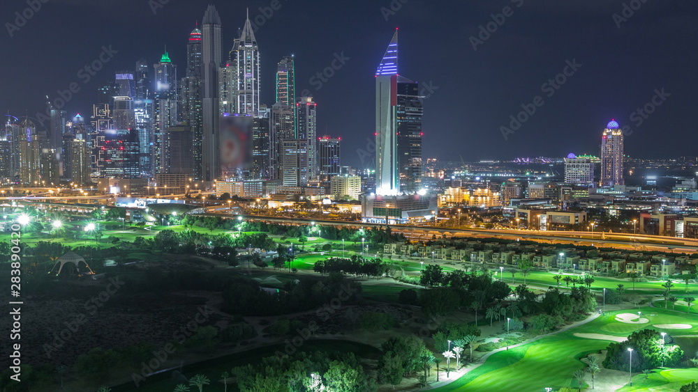 Dubai Marina skyscrapers and golf course night timelapse, Dubai, United Arab Emirates