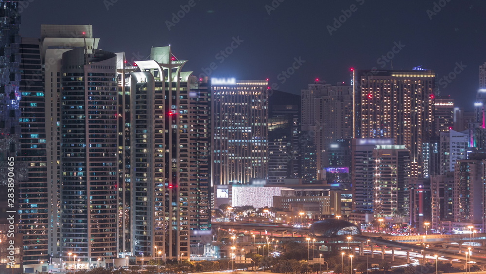 Jumeirah lake towers skyscrapers and golf course night timelapse, Dubai, United Arab Emirates Jumeirah lake towers skyscrapers and golf course night timelapse, Dubai, United Arab Emirates