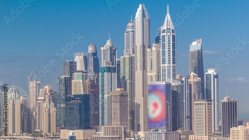Dubai Marina skyscrapers and golf course morning timelapse, Dubai, United Arab Emirates © neiezhmakov