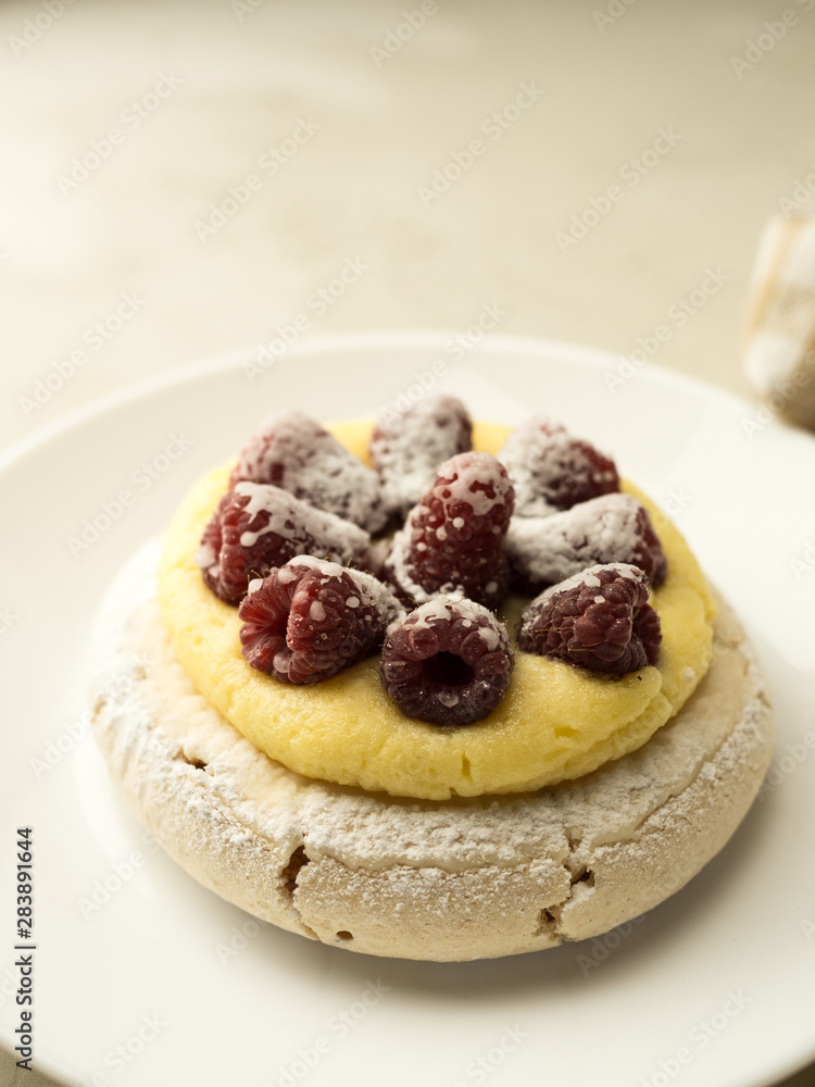 Close up of meringue cake with raspberries Close up of meringue cake with raspberries