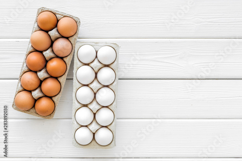 Farm products with eggs on white wooden background top view mock up