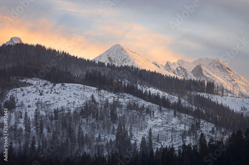 A warm light of a sunset in winter mountains - Tatra mountains in Poland.