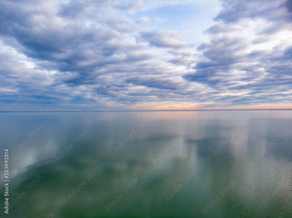 Nice clouds reflection on the lake Balaton in Hungary, aerial picture
