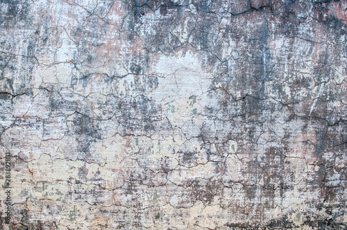 gray texture of old wall with cracked plaster