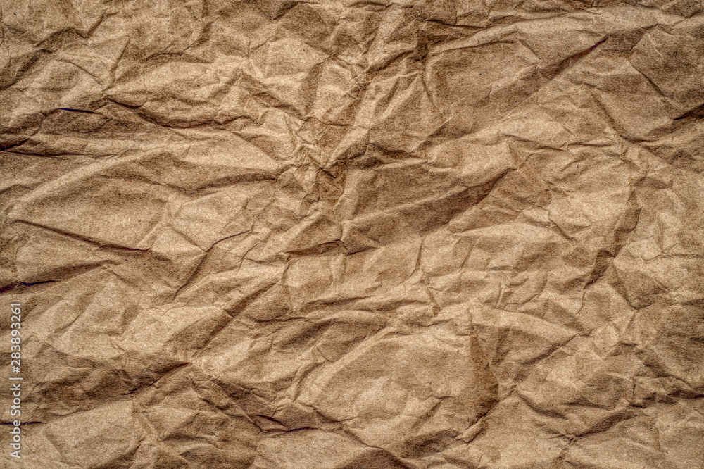 Obraz premium Texture of beige crumpled paper. Vintage background 