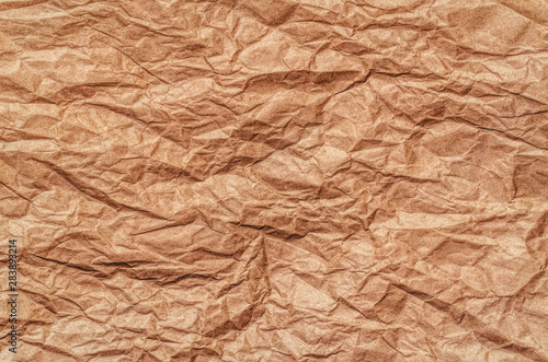 Texture of beige crumpled paper. Vintage background