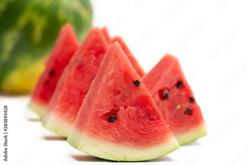 watermelon on white background. Ripe watermelon - a symbol of summer. Pieces of watermelon watermelon on white background. Ripe watermelon - a symbol of summer. Pieces of watermelon