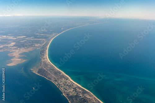 Aerial view of peninsula between Ria Formosa and Atlantic Ocean in Portugal photo