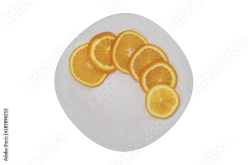 Orange fruit segments isolated on white plate. Clipping Path