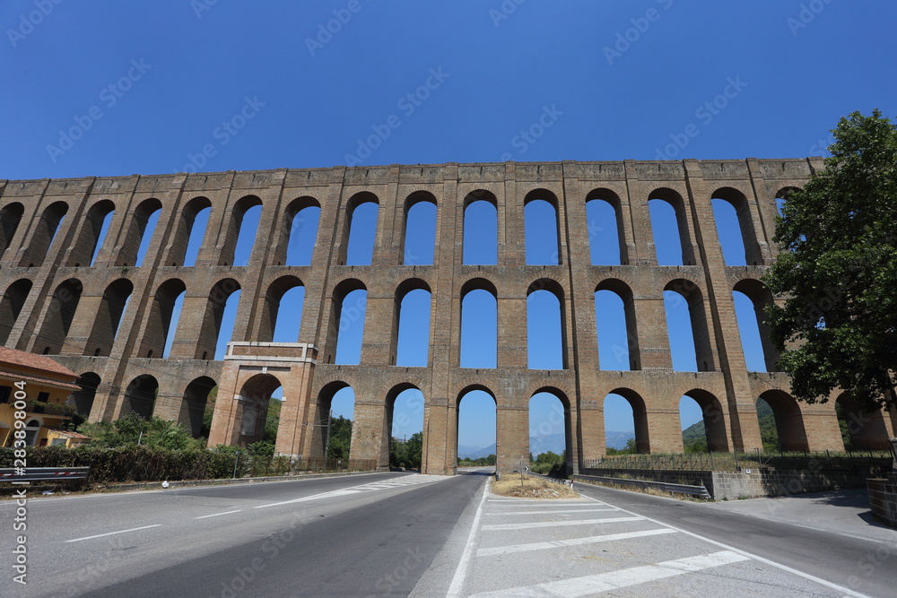 Maddaloni, Italy - 12 August 2019: The Carolino aqueduct created for the complex of San Leucio and the Royal Palace of Caserta Maddaloni, Italy - 12 August 2019: The Carolino aqueduct created for the complex of San Leucio and the Royal Palace of Caserta