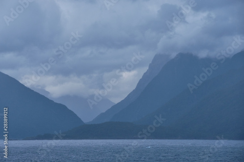 Cloudy and rainy morning in Fjordland, New Zealand photo