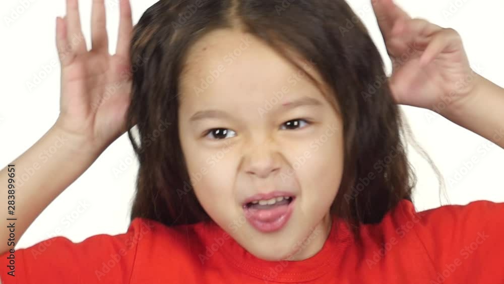 Close-up girl have fun, act the ape and shows tongue. Slow motion Close-up girl have fun, act the ape and shows tongue. Slow motion