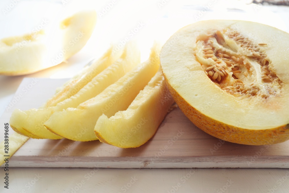 Ripe juicy melon for breakfast. Appetizing melon on a white background. Pumpkin Ripe juicy melon for breakfast. Appetizing melon on a white background. Pumpkin