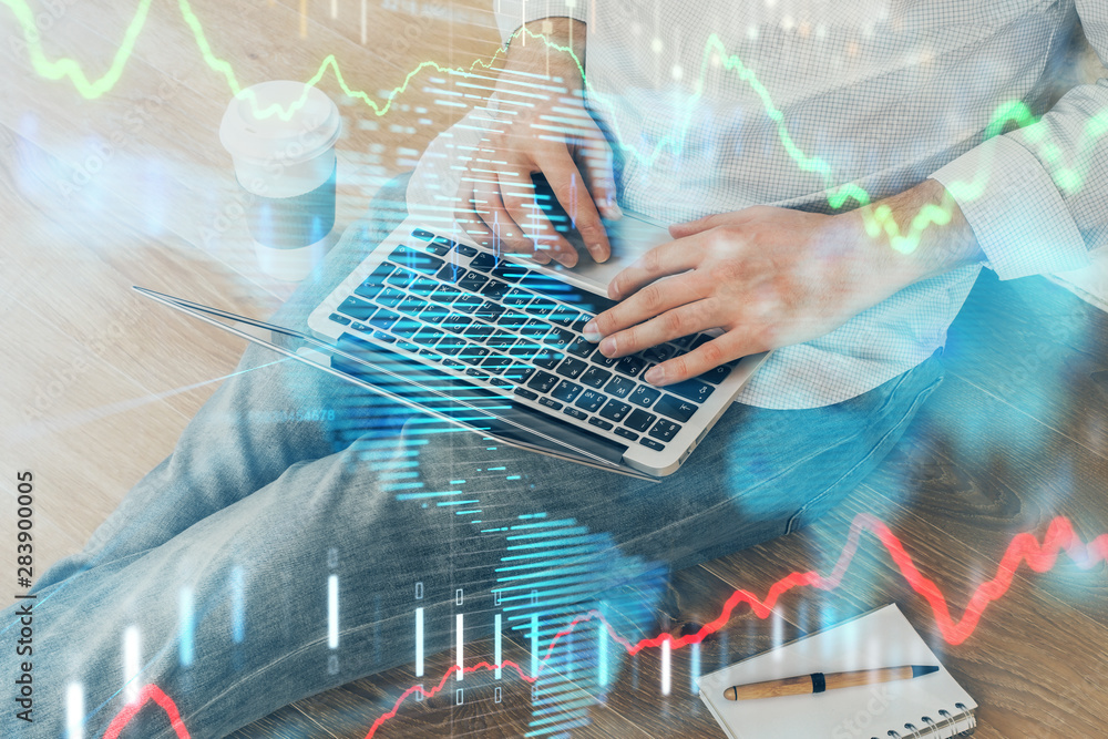 Forex graph with businessman working on computer in office on background. Concept of analysis. Double exposure. Forex graph with businessman working on computer in office on background. Concept of analysis. Double exposure.