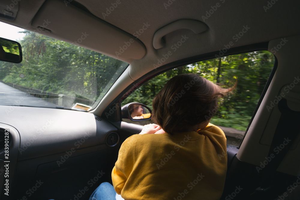 girl traveling in a car