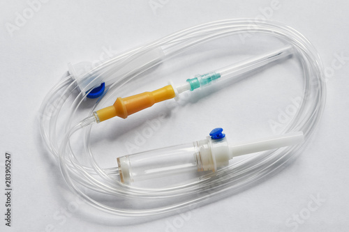 Medical intravenous infusion set on white background