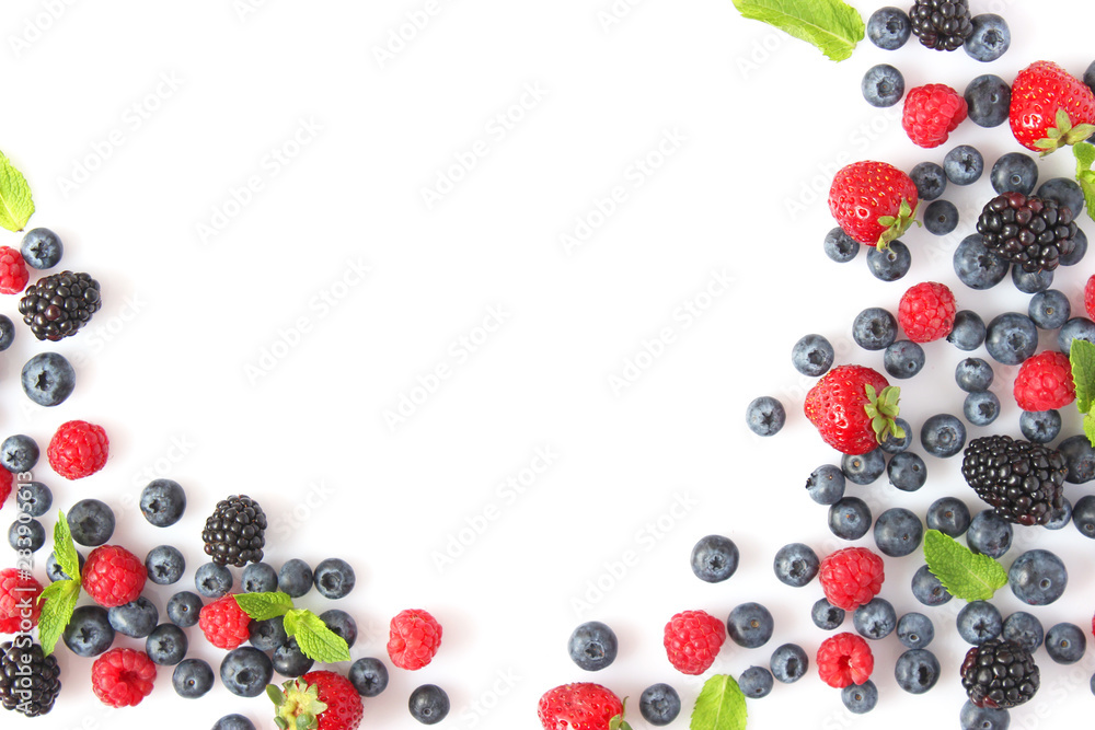 wild berries and mint leaves on a white background top view. blueberries, raspberries, strawberries, currants, blackberries wild berries and mint leaves on a white background top view. blueberries, raspberries, strawberries, currants, blackberries