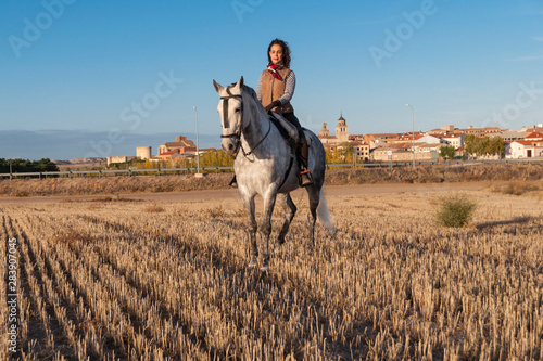 young woman on horseback