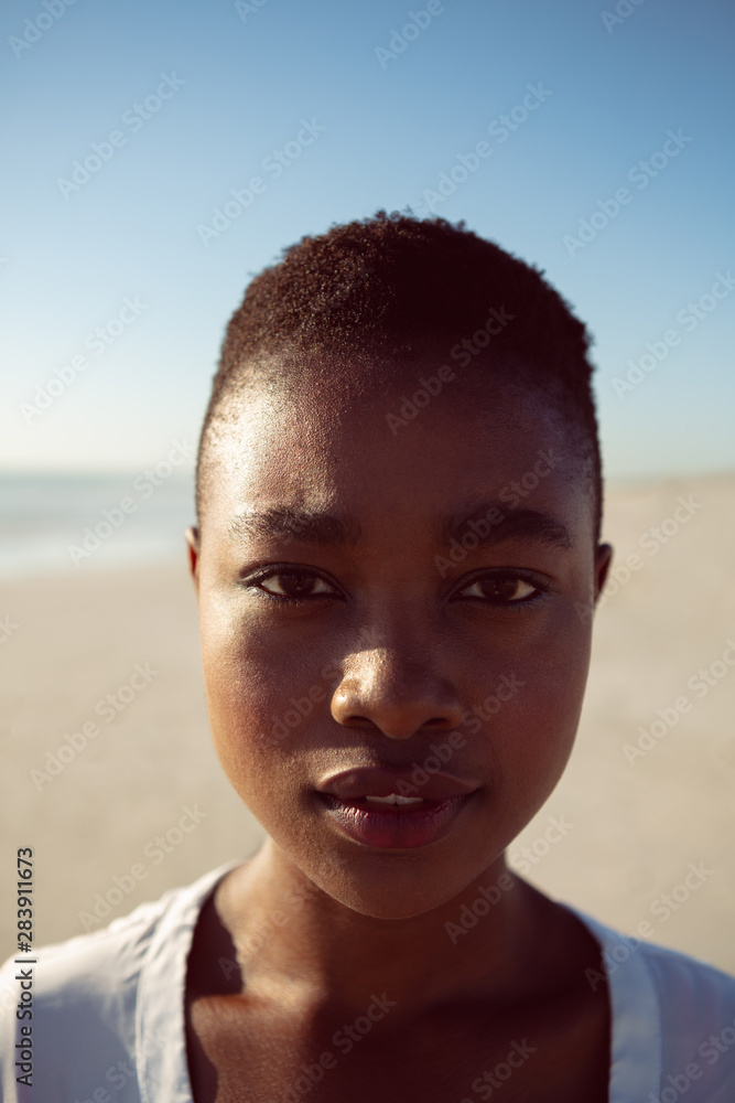 Beautiful woman standing on the beach Beautiful woman standing on the beach
