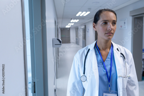 Female doctor standing in the corridor at hospital