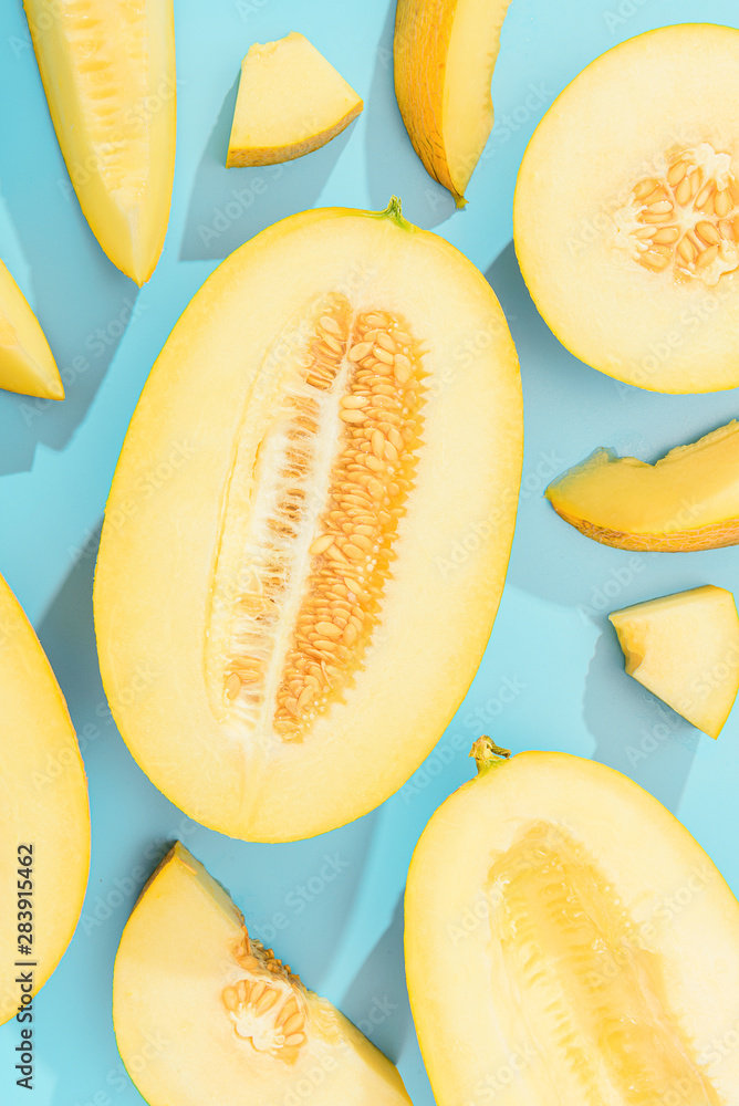 background with melon. sliced sweet and ripe melon on a blue background. background with melon. sliced sweet and ripe melon on a blue background.