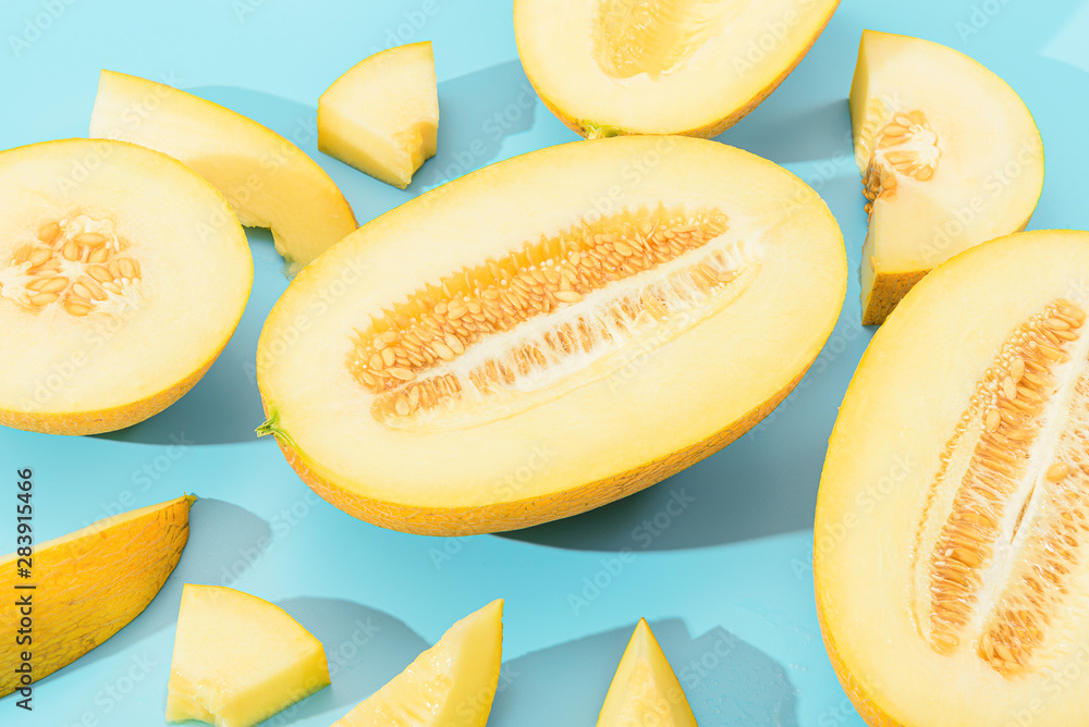 background with melon. sliced sweet and ripe melon on a blue background. background with melon. sliced sweet and ripe melon on a blue background.