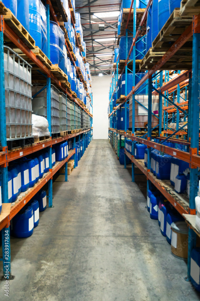 Fototapeta premium Barrel and crates on a rack in warehouse