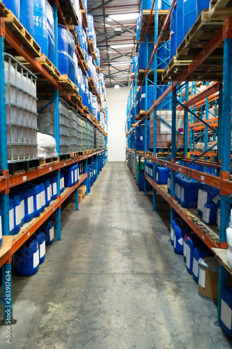 Barrel and crates on a rack in warehouse