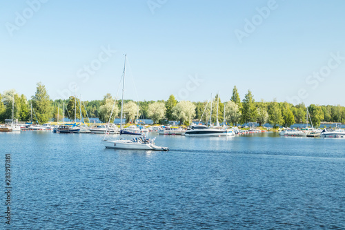 Lappeenranta, Finland - August 7, 2019: Lappeenranta port with yachts and boats on a sunny summer day photo