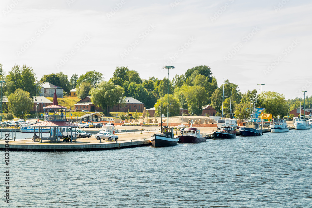 Lappeenranta, Finland - August 7, 2019: Lappeenranta port with yachts and boats and sand castle on a sunny summer day