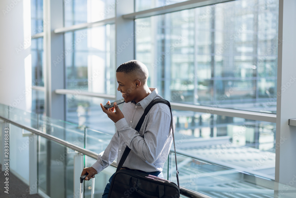 Businessman using smartphone in modern building Businessman using smartphone in modern building