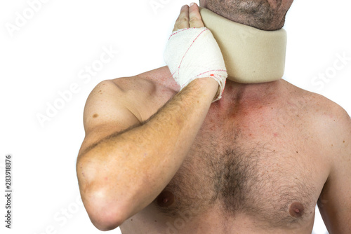 injured shirtless man with cervical collar, isolated in white photo